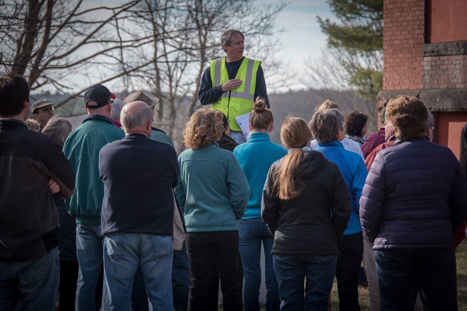 John on rock with ppl